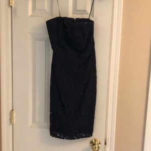 Strapless dress, lace over lining. Zipper in back. Navy blue.